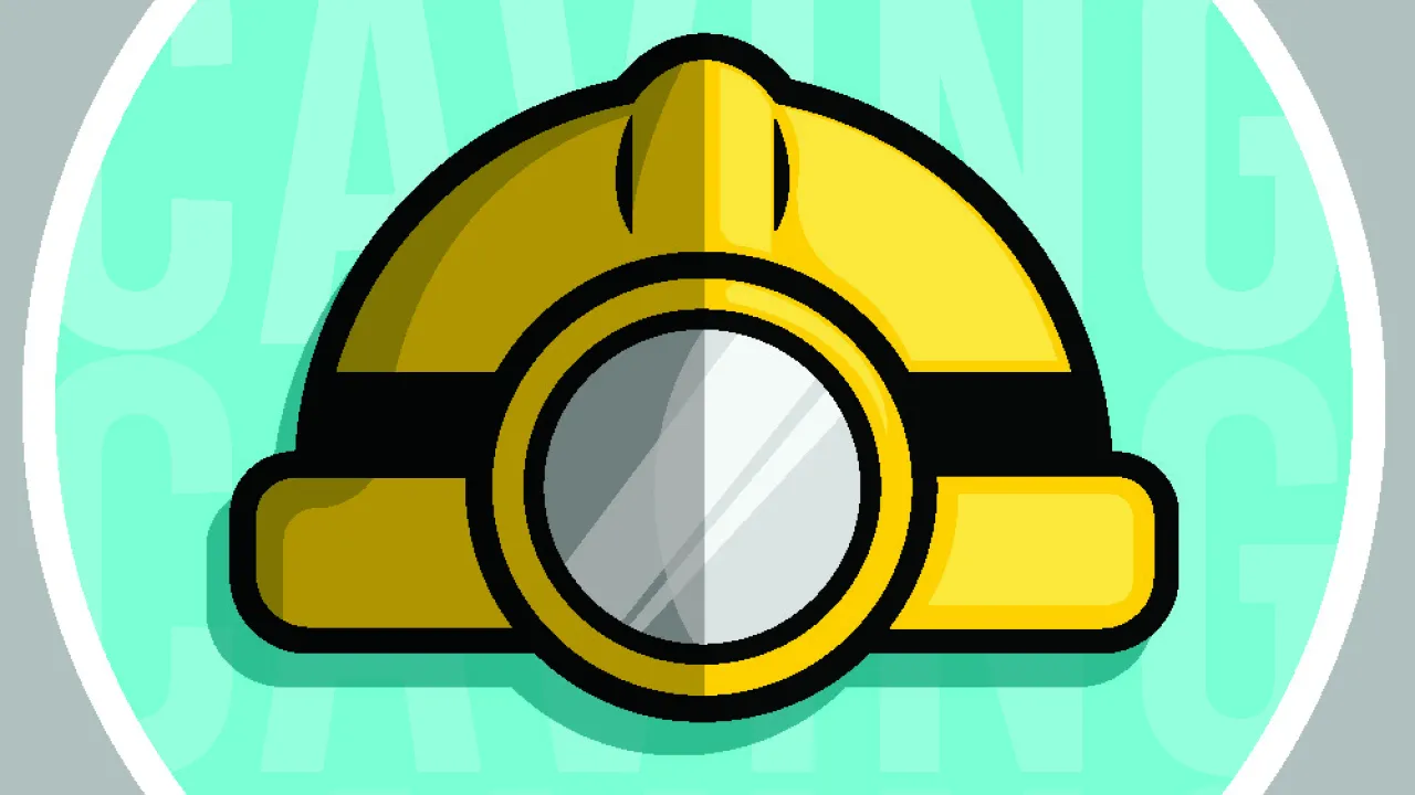 Yellow caving helmet on a light blue background