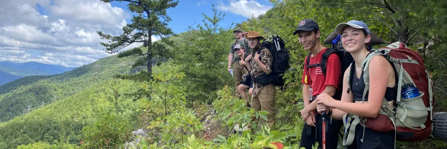 Smiling backpackers on the trail