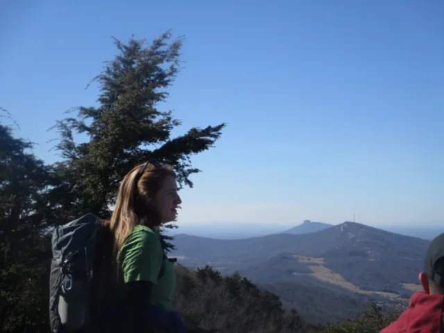 Woman in profile with North Carolina mountains in the distance