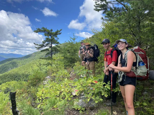Smiling backpackers on the trail